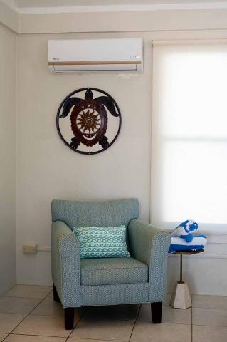 The image features a neatly arranged room corner with several distinct items