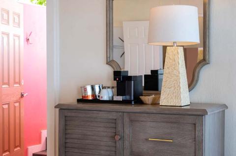 This image features a wooden console table in an interior setting, showing a modern and cozy design