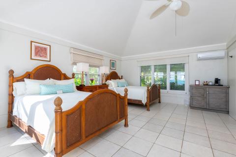 This image shows a spacious, well-lit bedroom