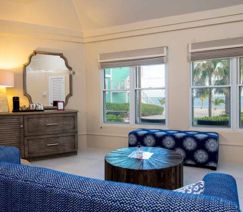 The image shows an elegantly decorated room with a coastal theme