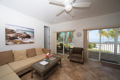 This image shows a beautifully furnished beachfront living room
