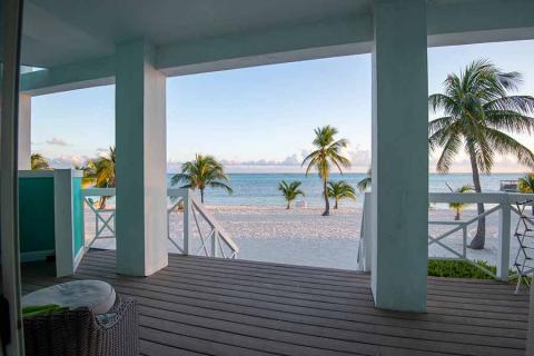 This image shows a serene beach view from a terrace