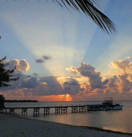 The image shows a beautiful sunset at the beach