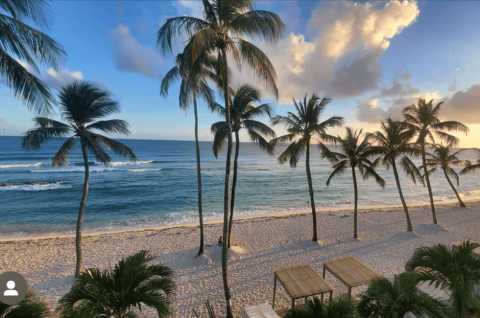 This image depicts a beautiful, serene beach setting