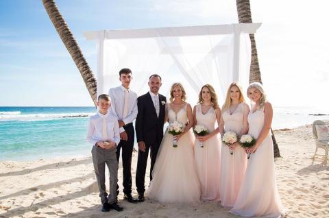 This image captures a beach wedding scene