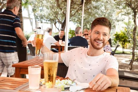 This image shows a happy scene at an outdoor restaurant