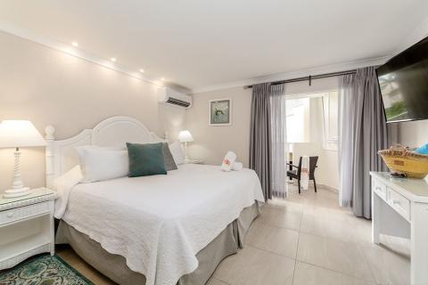 This image shows a modern and well-decorated hotel room
