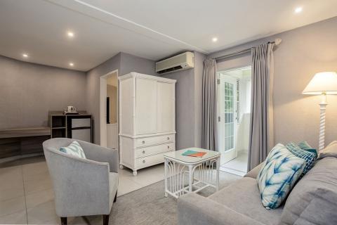 This image shows a well-furnished room that is decorated in a contemporary style