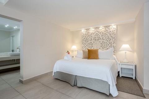 The image shows a neatly arranged bedroom