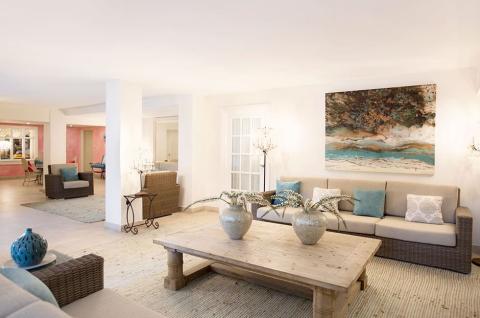 This image displays a spacious and elegantly decorated living room