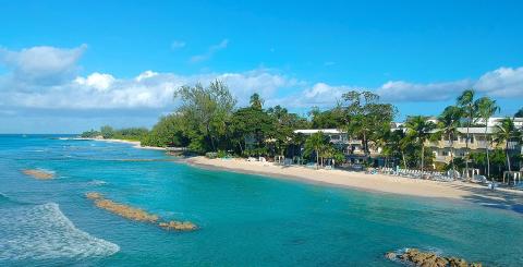 This image shows a picturesque aerial view of a tropical beach resort