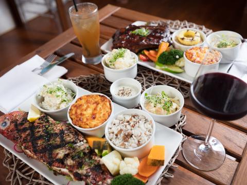 This image features a beautifully arranged meal spread on a wooden table