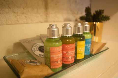 This image features a collection of personal care products arranged neatly on a shelf