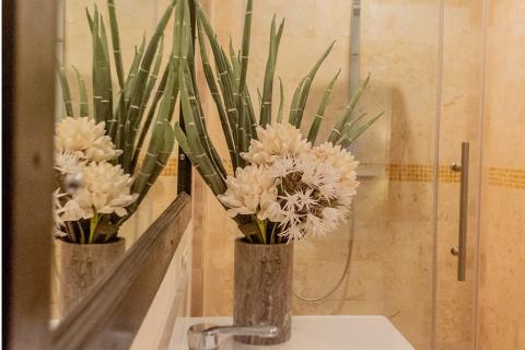This image features a decorative scene inside a bathroom