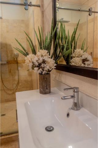 This image shows a modern bathroom sink area