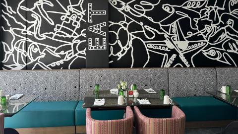 This image shows an interior view of a modern and stylish dining area
