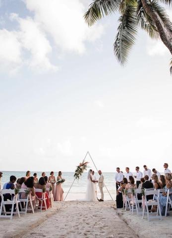 This image captures a beach wedding scene