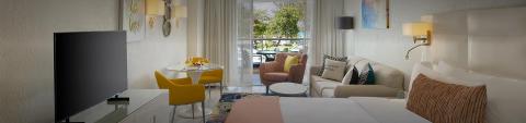 This image showcases a modern and stylish hotel room or a studio apartment