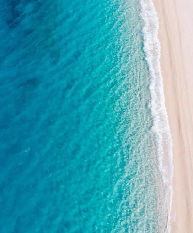 This image shows a beautiful aerial view of a beach