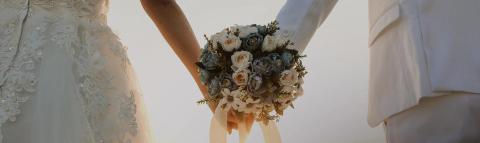 This image captures a close-up view of two individuals, possibly a couple, during what appears to be a wedding ceremony